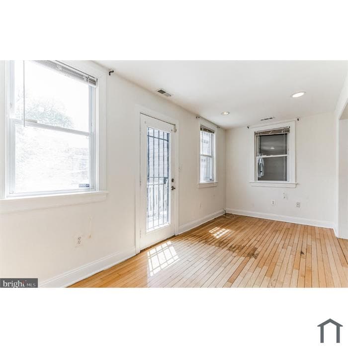 Sunlit room with hardwood floors